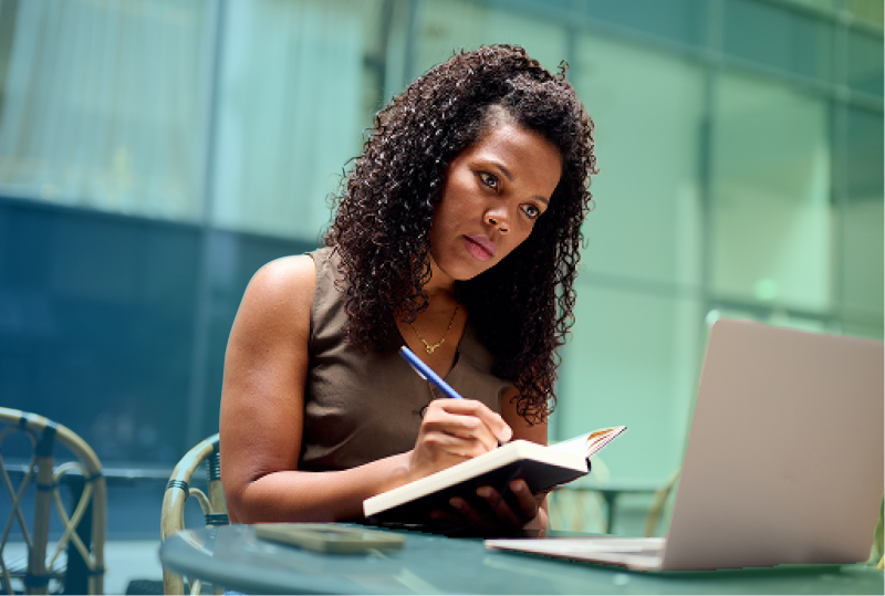 An employee is filling out an offboarding survey at their desk