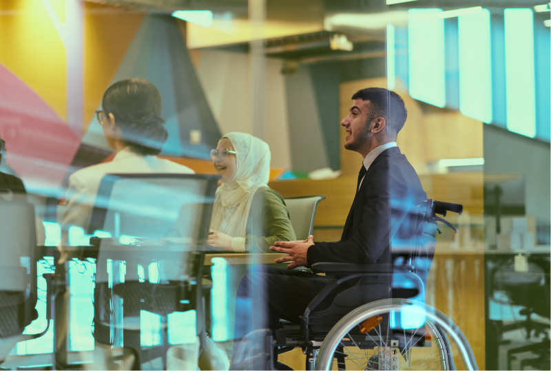 A workplace accommodation training is being provided to a group of employees in an office boardroom